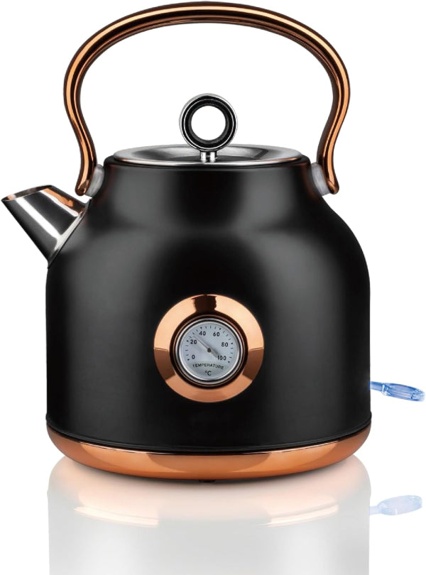Black electric kettle with copper accents on a white background